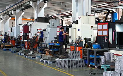 The operator is manually adjusting the slitting line