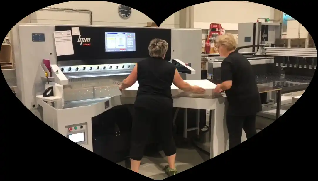 HPM technicians installing paper cutting machine on-site