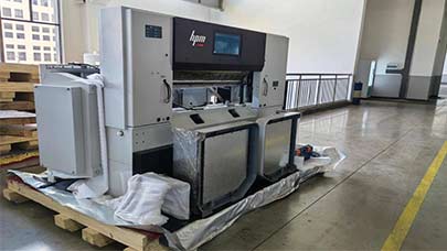 A paper cutter machine being inspected and delivered at Chinahpm factory scene